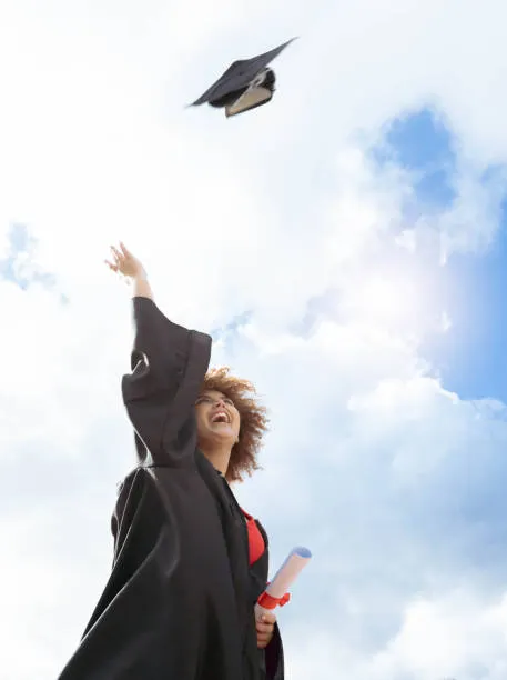 black woman graduation and cap in air for celebration happiness or success with diploma for